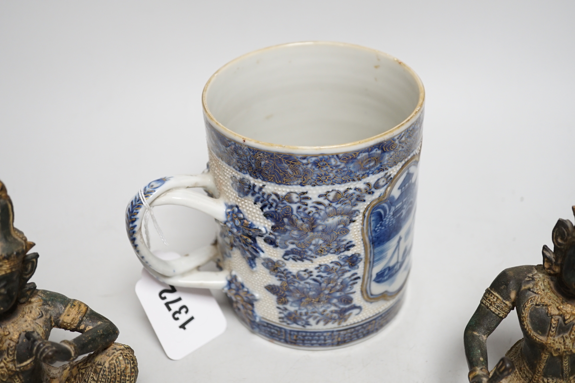 An 18th century Chinese export blue and white mug and two Thai bronze figures, mug 13cm tall